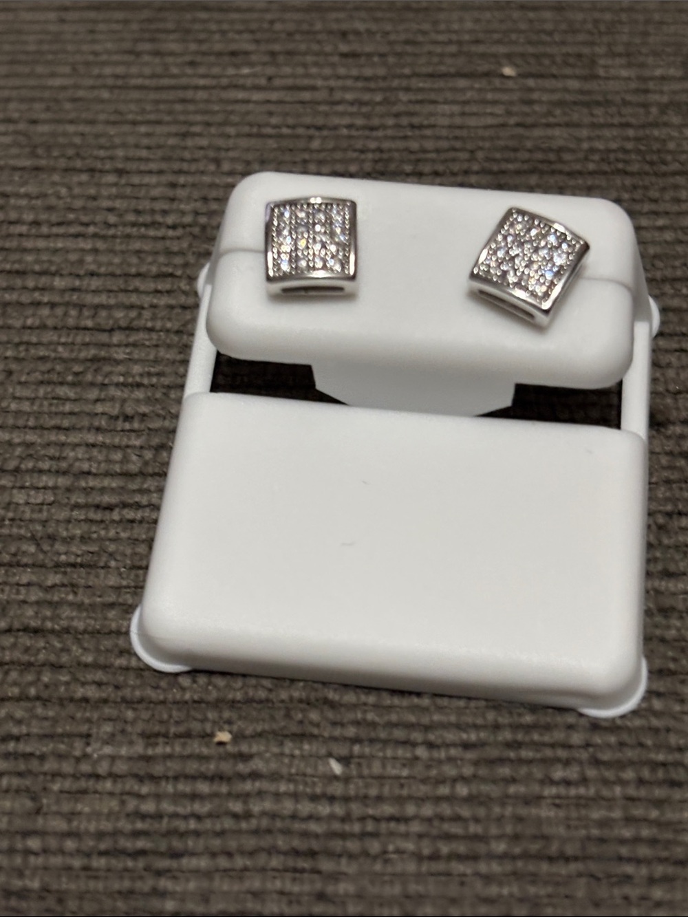 Square pave stud earrings.- Sparkling Silver Tone. Anti tarnish